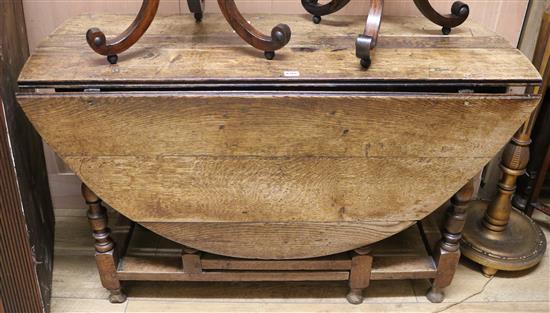 An 18th century oak oval topped gateleg table, W.120cm